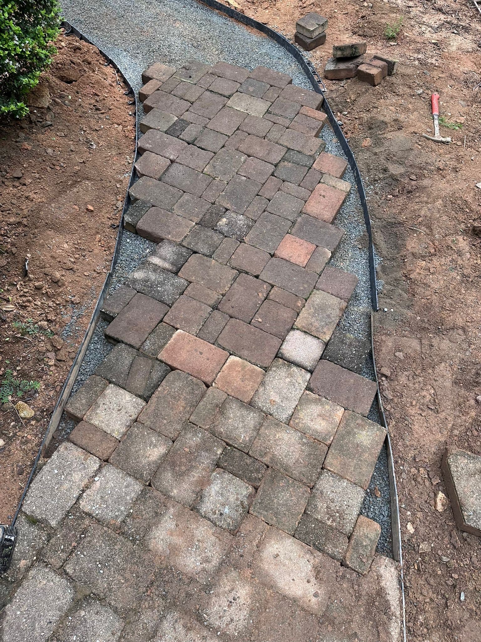Tumbled pavers laid in a curving walkway