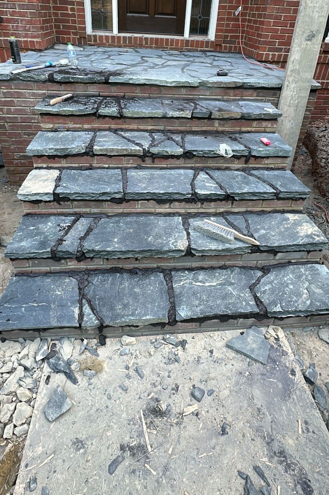 Flagstone stair with brick risers, joints freshly pointed