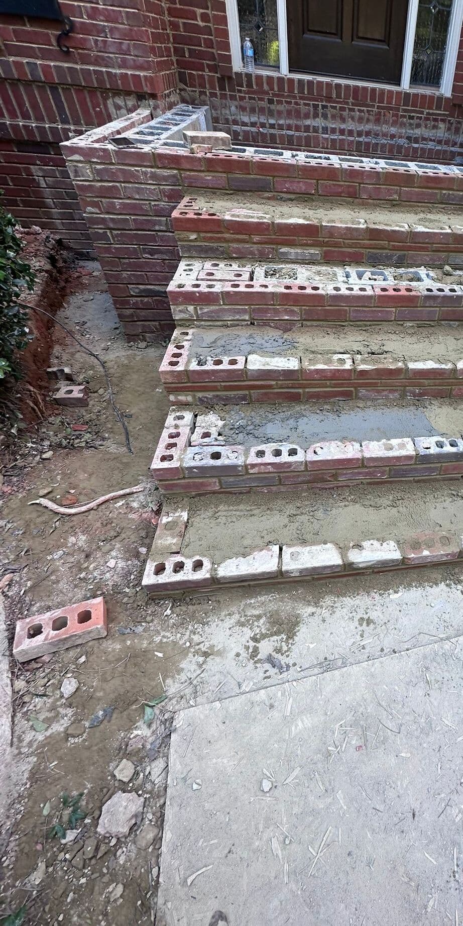 Brick step risers going back up over a concrete block core