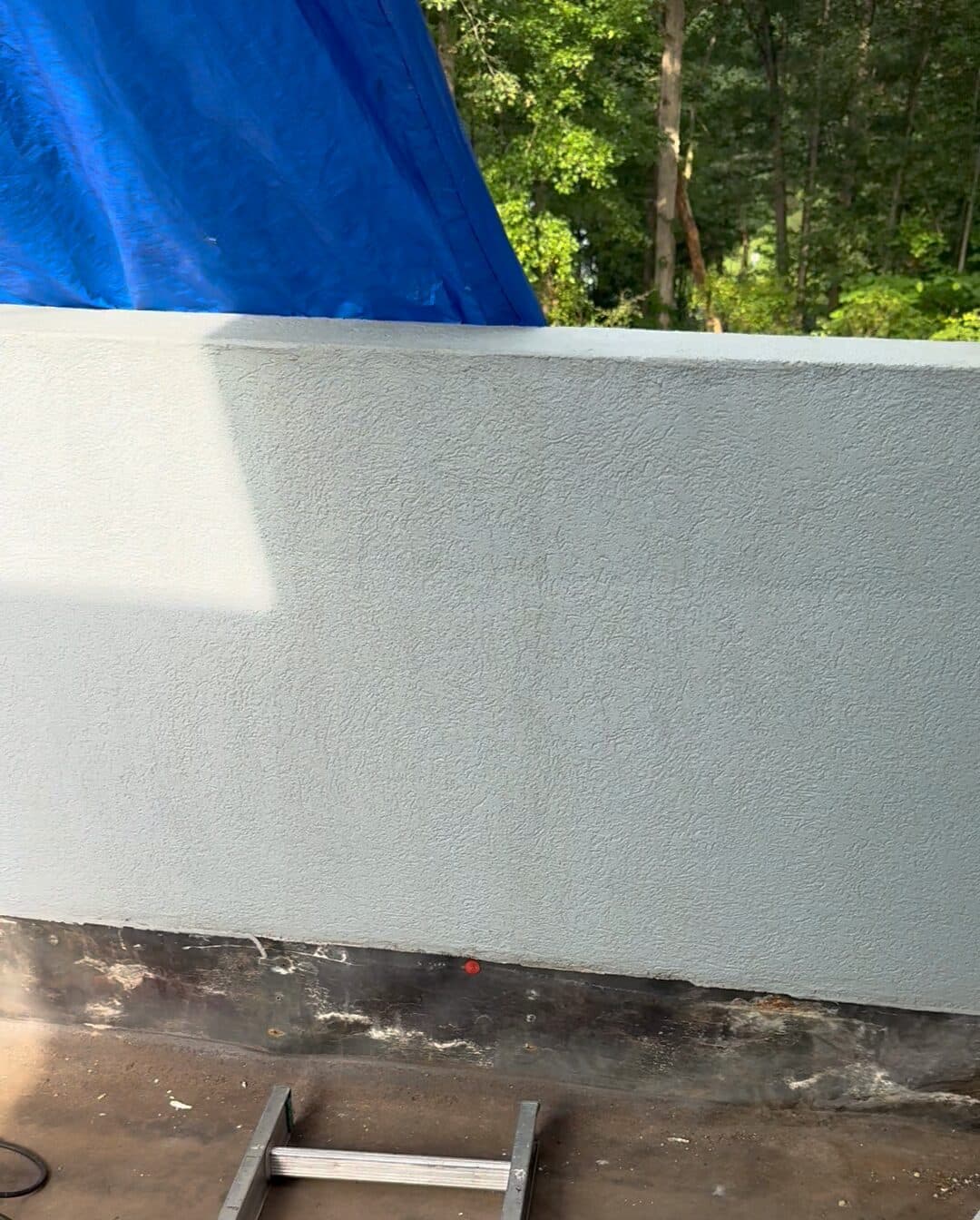 Balcony parapet with a smooth grey finish
